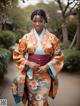 A woman in an orange and blue kimono posing for a picture.